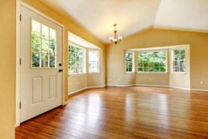 Large empty newly remodeled living room with wood floor.